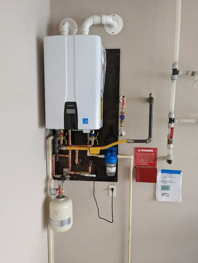 Professional plumber installing copper piping in a Pleasure Point home